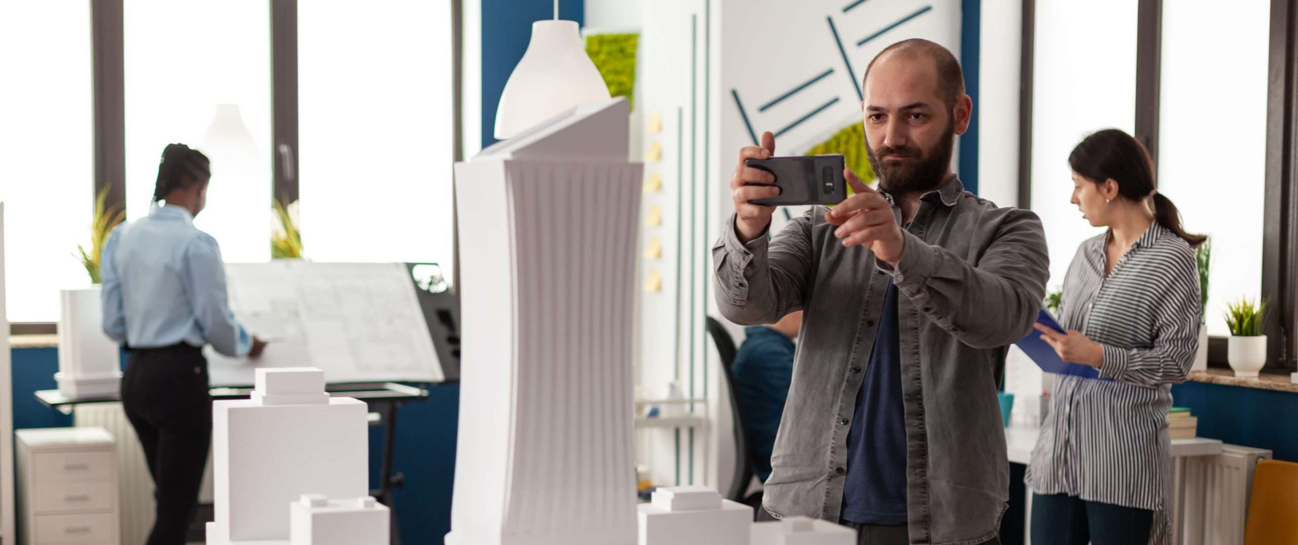 Architect profession man looking at maquette layout