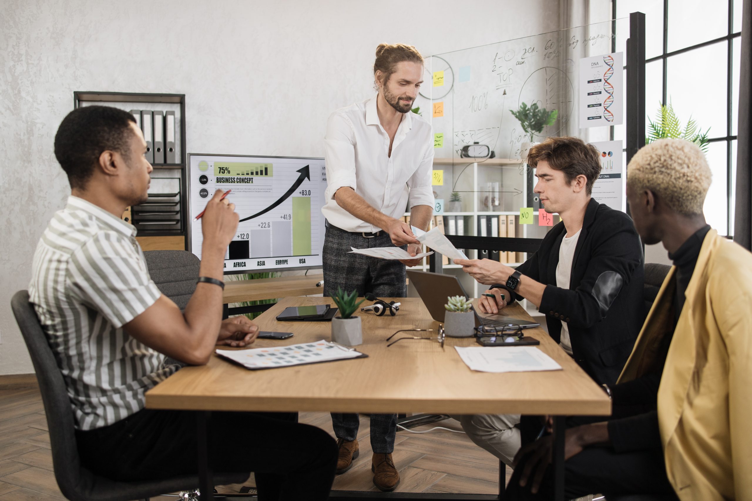 Multi ethnic male financiers discussing strategy solution for company development